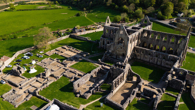 Stunning aerial view of a ruined cathedral in Wales – a powerful symbol of history, faith, and impermanence, ideal for cultural tourism and historic sightseeing in the UK.
