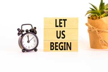 Let us begin symbol. Concept words Let us begin on beautiful wooden blocks. Beautiful white...