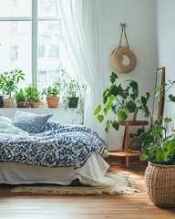 Bright bedroom with blue and white bedding, plants, and natural light.