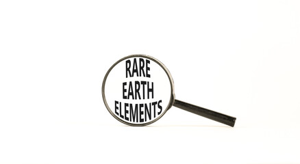 Rare earth elements symbol. Concept words Rare earth elements in beautiful magnifying glass. Beautiful white background. Business and rare earth elements concept. Copy space.