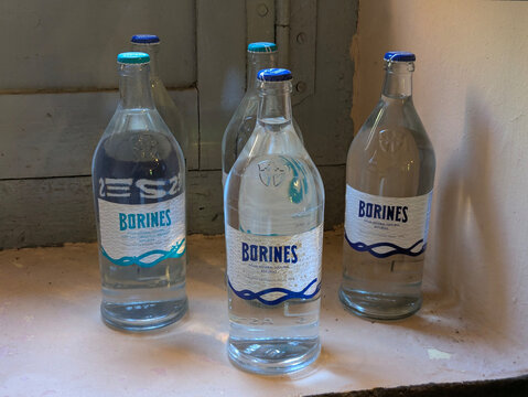 Old bottles of Borines mineral water at Borines mineral spring and bottling plant (built in 1892), Pilo a municipality, Asturias, Spain