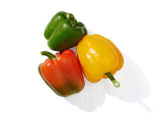 Red, yellow and green pepper on white background
