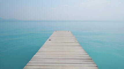 Fototapeta premium Serene Wooden Dock Extending into Turquoise Ocean