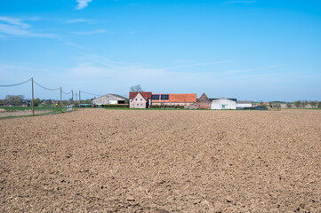 Fototapeta premium Senic view over farmland at the Flemish countryside in Poperinge, West Flanders, Belgium