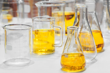 Glass vials with urine samples on laboratory table in medical analytical laboratory in hospital. pharmaceutical chemistry concept background