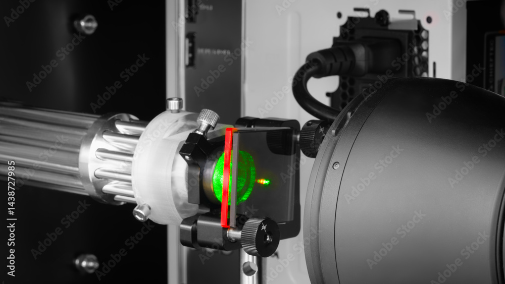 Poster a green laser passes through optical instruments in a physical optical science laboratory