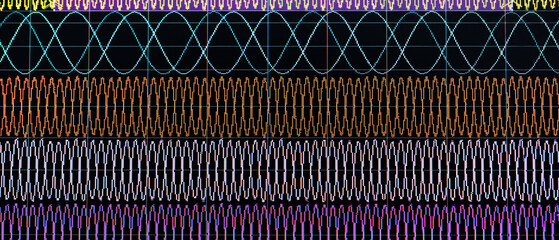 Electronic signal meter screen with wave frequency graphs.