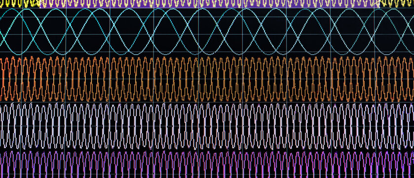 Electronic signal meter screen with wave frequency graphs.