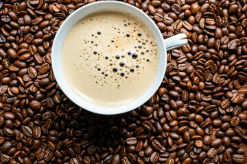 coffee beans in a vintage white cup