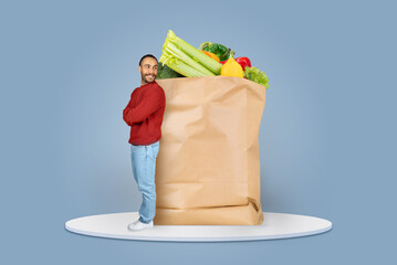 Customers adapt to the new normal by purchasing groceries online and using delivery services. A man...