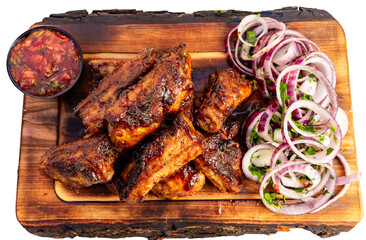 Savory grilled ribs served with fresh vegetables and sauce