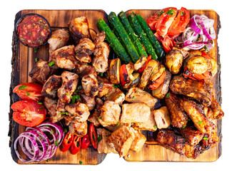 Grilled meat platter with vegetables served at a summer gathering