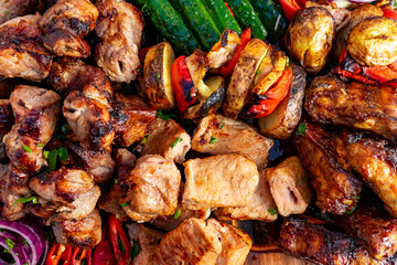 Grilled meats and vegetables served at outdoor barbecue event