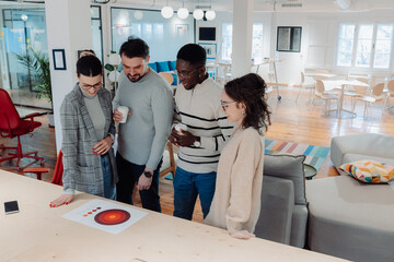 Marketing professionals analyzing target market data in modern office