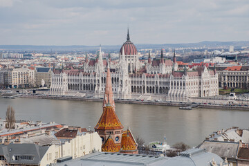 Obraz premium A panoramic view of the city of Budapest in Hungary over the river Danube as seen from Buda Castle; with the parliament building.