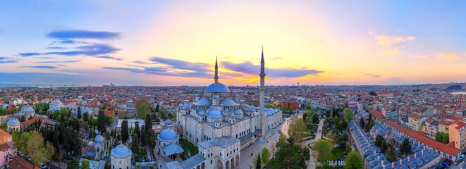 Stunning Aerial View of Istanbul's Fatih Mosque Sunset. A breathtaking aerial panorama of Istanbul, Turkey, centered on the Fatih Mosque at sunrise. Sultanahmet Mosque, Ayasofya, Suleymaniye. Kandil © Turkey Photo