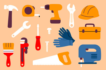 Collection of hand tools, gloves, hard hat, and power tools for construction or repair 