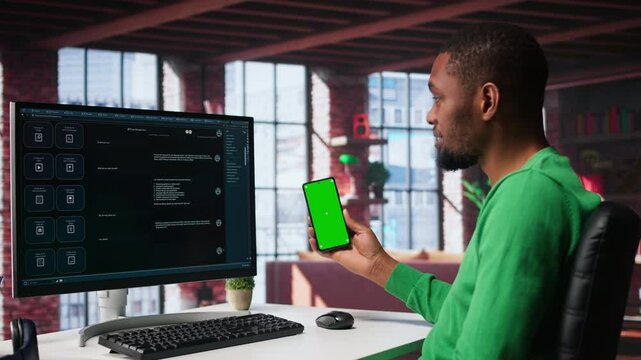 Black guy interacting with intelligent AI chatbot on pc next to copy space screen, using smart innovative system. Machine learning enhances efficiency through advanced algorithms. Camera B.