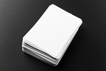 Stack of blank playing cards on a dark surface