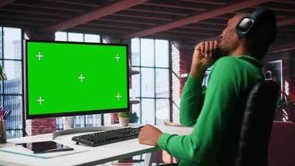 Young adult at home office analyzing data charts on mockup computer, interpreting statistical graphs and identifying trends. Reviewing analytical reports and processing info. Camera B. - Powered by Adobe