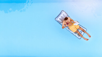 Relax, drink and man on inflatable in swimming pool for summer vacation, weekend break or getaway...