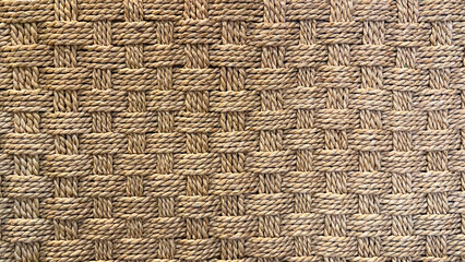 Close-up shows an intricate woven fiber pattern, a textured background.