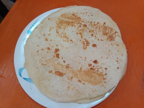 Bangladeshi Paratha roti. Flatbread snacks.  Flour tortilla's main ingredient is flour with salt, water, and oil. 