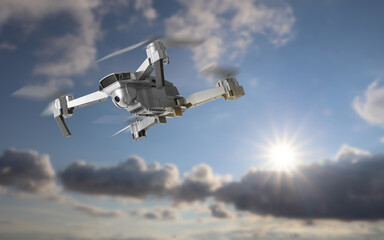 Drone with camera flying in sky. Unmanned aerial vehicle for surveillance