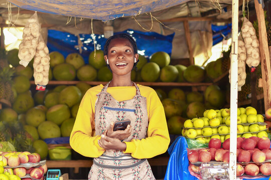 fruit sales persons on apron immersed in a wireless connectivity technology