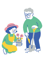 Elderly couple planting flowers in their garden_Color