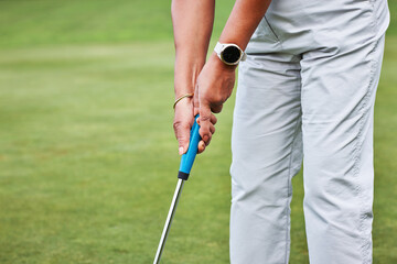 Golf, swing and hands of a person with sport, fitness and workout outdoor on grass on the green. Club, health and training with golfer stroke, course and play for exercise in a game with aim for hole