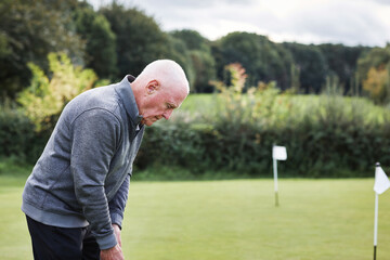 Golf, senior man and sports with exercise, hobby and pensioner with activity and recreation. Elderly guy, fitness and golfing with game or swinging a club with summer break or training with equipment