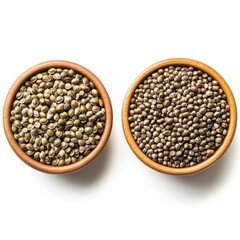 Close-up of organic raw brown buckwheat seeds in a wooden bowl, isolated on white