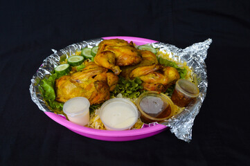 Nasi biryani or biriani, beriani, or briyani is a dish in the form of rice cooked with spices and then added with vegetables or meat.