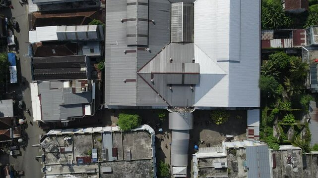Aerial View of city buildings, market and dense population sub-district area in Southeast Asia. Architecture from above 