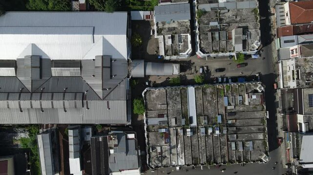 Aerial View of city buildings, market and dense population sub-district area in Southeast Asia. Architecture from above 