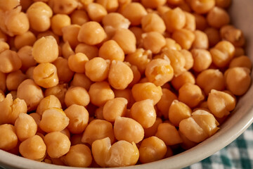 A bowl of soaked chickpeas, also called garbanzo beans or channa.