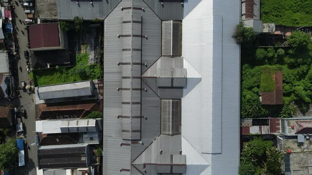 Aerial View of city buildings, market and dense population sub-district area in Southeast Asia. Architecture from above 