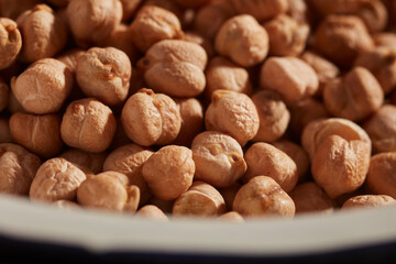A bowl of dried chickpeas, ready for soaking and cooking