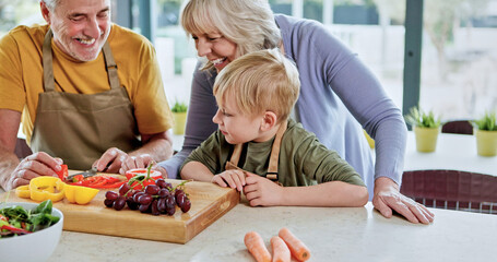 Smile, grandparents or child cooking for lunch, vegetables or nutrition with love in family home. Fruits, happy grandfather or kid with elderly grandma, care or food for diet, teaching or learning