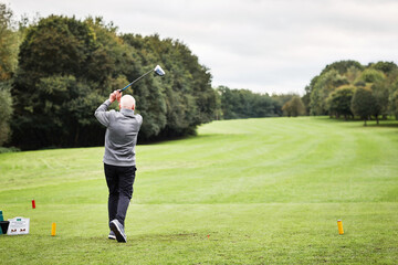 Golf, sunshine and game with senior man, player and competition with hobby and fitness with training. Old person, golfer and athlete with practice or outdoor with activity and trees with recreation