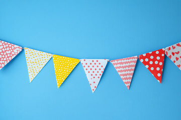 Fototapeta premium Colorful birthday party decorations on a light blue background with copy space, top view. Birthday banner border design template.