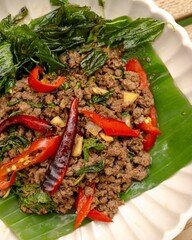 Savory stir-fried beef with basil and peppers local market food photography rustic kitchen close-up culinary delight