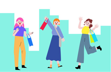 街で買い物袋を持つ女性達