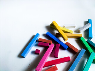 colorful chalk pastels on white background