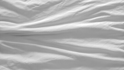 White and wrinkled bed sheet wave background. close up wave fabric.