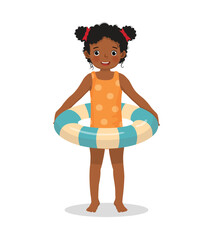 little African boy with swimsuit holding inflatable swim ring having fun on summer time