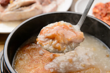 Boiled chicken and scorched rice soup, a Korean dish
