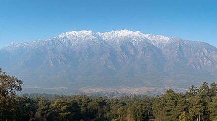 Snowy mountain range panorama. Lush valley below