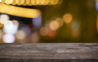 Empty wood table top and blur of restaurant background selective focus product display